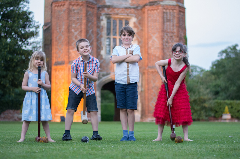 Kids playing croquet at Leez Priory wedding